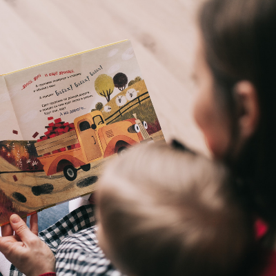 Photo of a parent reading to their child
